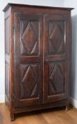 A stained ash and beech cupboard, basically 18th Century,