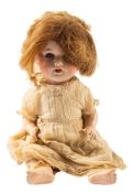 A Simon & Halbig bisque head baby doll, applied brown wig over blue glass sleeping eyes,
