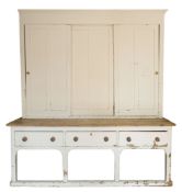 A substantial Victorian white painted pine housekeeper's cupboard or dresser,