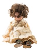 An Armand Marseille bisque head doll, black wig, blue glass sleeping eyes,