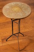 An Indian brass and blacked painted wrought iron mounted circular occasional table,