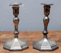 A pair of Victorian silver candlesticks, octagonal form, with detachable nozzles and loaded bases,