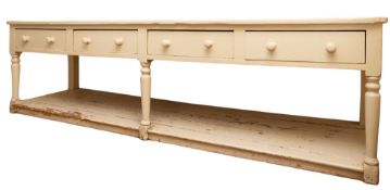 A substantial Victorian cream painted wood kitchen dresser,