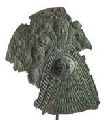 AN ASSYRIAN BRONZE ROUNDEL FRAGMENT, repoussé and chased with figures, birds and animals,