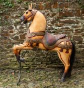 A carved and polychrome painted carousel horse,