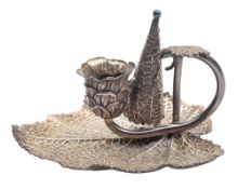 A Victorian silver chamberstick, in the form of a leaf, with a detachable conical snuffer,