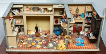 An early 20th century dolls house kitchen,