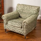 A green upholstered armchair,
