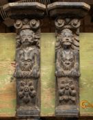 A pair of carved oak herm figures, 17th century; modelled as males,