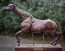 A carved and stained hardwood lay model of a horse, second half 20th Century; articulated overall,