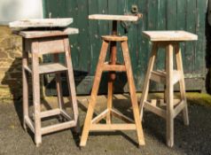 Three wooden adjustable sculpting stands, 20th Century;