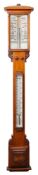 An early 20th century oak cased stick barometer,