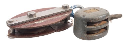 A large steel and composition snatch block, stamped 'AJ' and with ratings,