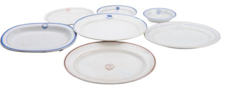 A group of seven various shipping line serving plates and dishes,