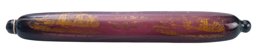 A late 19th century purple glass rolling pin with gilt 'Forget Me Not' inscription and HMS