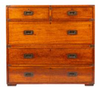 A late 19th/early 20th century teak and brass bound campaign chest of drawers,
