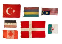 A group of seven various national ensigns, comprising Denmark, Malaysia, Canada, Mauritius, Turkey,