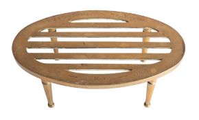 An early 20th oval brass trivet inscribed 'HMS 'Cambridge- HMS 'Virginian.