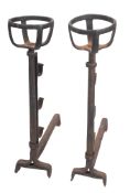 A pair of wrought iron andirons in Mediaeval style, possibly French,