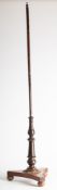 A Victorian mahogany pole screen base. Having a turned central shaft on a triform base, 132cm high.