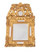 A late 19th Century Continental carved giltwood marginal wall mirror, of small size,