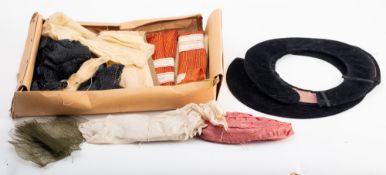 A quantity of hat making materials. Including brims and band lengths etc.