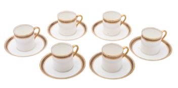 An Aynsley porcelain coffee service comprising six cans and six saucers with gold and black scale