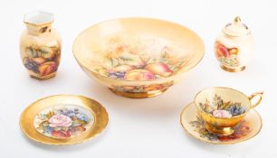A group of Aynsley Orchard Gold comprising a large bowl, a jar and cover and a vase,