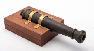 A small bronze signal cannon, flared muzzle with two stage barrel and round cascabel,