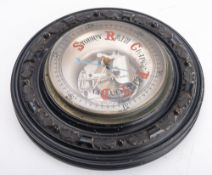 A late 19th/early 20th century circular ebony aneroid barometer, unsigned,