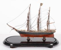 A late 19th century scratch built model of a clipper under glass dome,