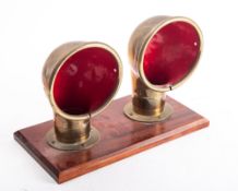 A pair of 5 1/2 inch brass deck vent, of typical form,