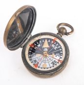 An early 20th century brass pocket compass, maker J H Steward, London,