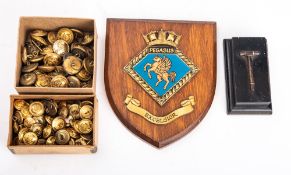 A WWI torpedo safety pin mounted on an ebonised plinth with plaque.