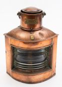 A small copper and brass ship's lamp, maker W T George & Co Ltd , Birmingham,