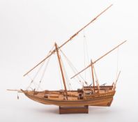 A scale model of a felucca or bek style sailing boat,