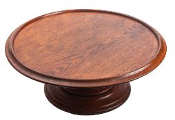 A 19th century oak lazy susan constructed from the timbers of an 18th century Royal Navy vessel,