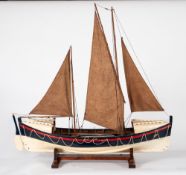 A scale model of a late 19th century RNLI pulling and sailing lifeboat,