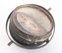 A 4 1/2 inch dry card compass, unsigned, in a gimbaled mount, 18cm wide.