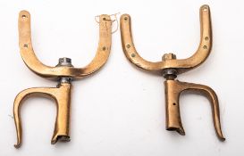 A pair of large brass rowlocks, unsigned,24cm high.