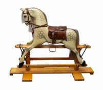 A contemporary Cockington, Torquay painted wooden rocking horse.