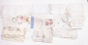 A Collection of early 20th Century and later tablecloths and napkins.