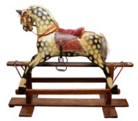 A 20th Century painted wooden rocking horse.