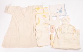 A mixed collection of early 20th Century and later children's clothes.