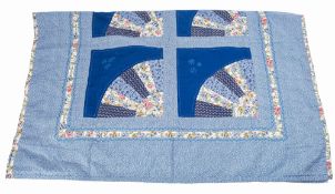 A 20th Century patchwork quilt.
