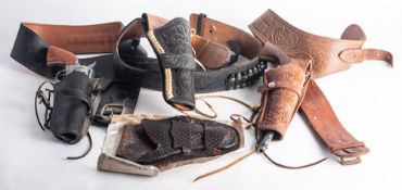 Two reproduction Colt style revolvers, together with tree leather holsters and belts.