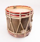 An early 20th Century brass and painted wooden marching drum.