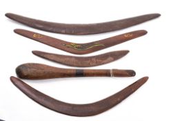 A group of four various boomerangs, two with carved decoration , largest 69cm long,