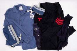 A collection of WWII era Royal Navy uniforms. Including shirts, jackets, jumpers and collars etc.