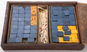 A mid 20th Century Mah-Jong set in a fitted wooden case.